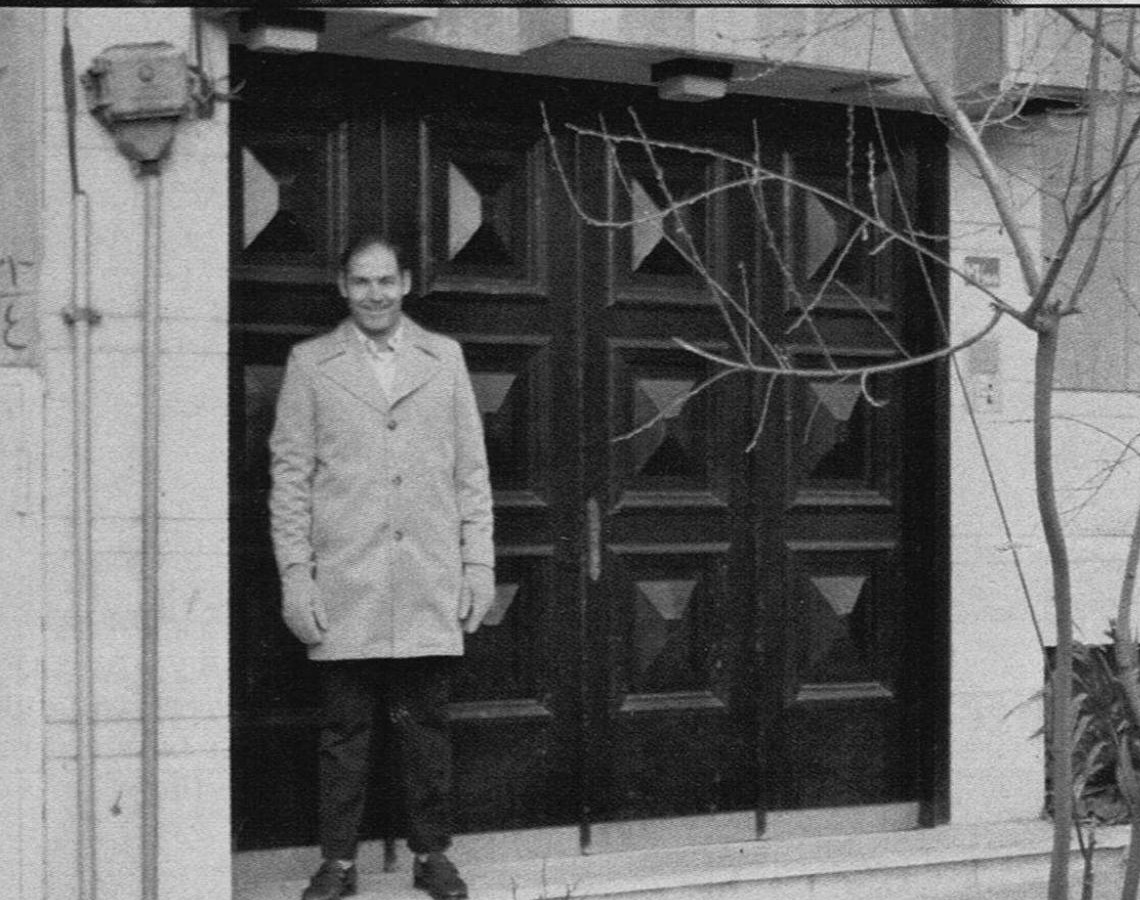 Hilbert Hayslett standing in front of the carved wooden doors of the family's Tehran residence