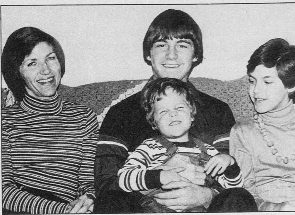Jerrianne Hayslett with her children Chris, Chapen, and Carrianne, seated together on a sofa